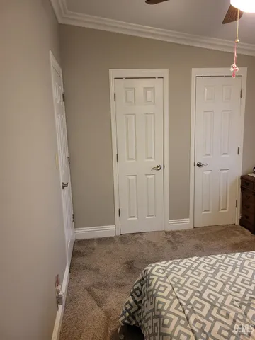 a bedroom with a bed and a closet