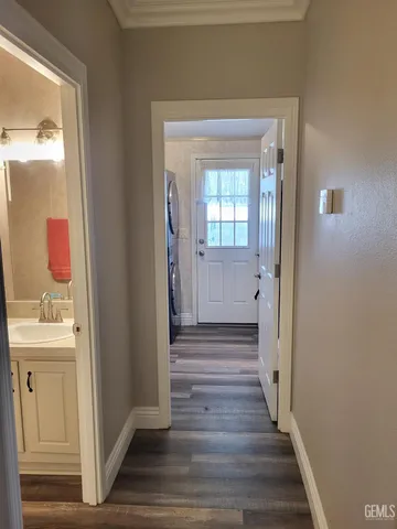 a view of a bathroom from a hallway