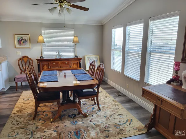 a dining room with furniture and window