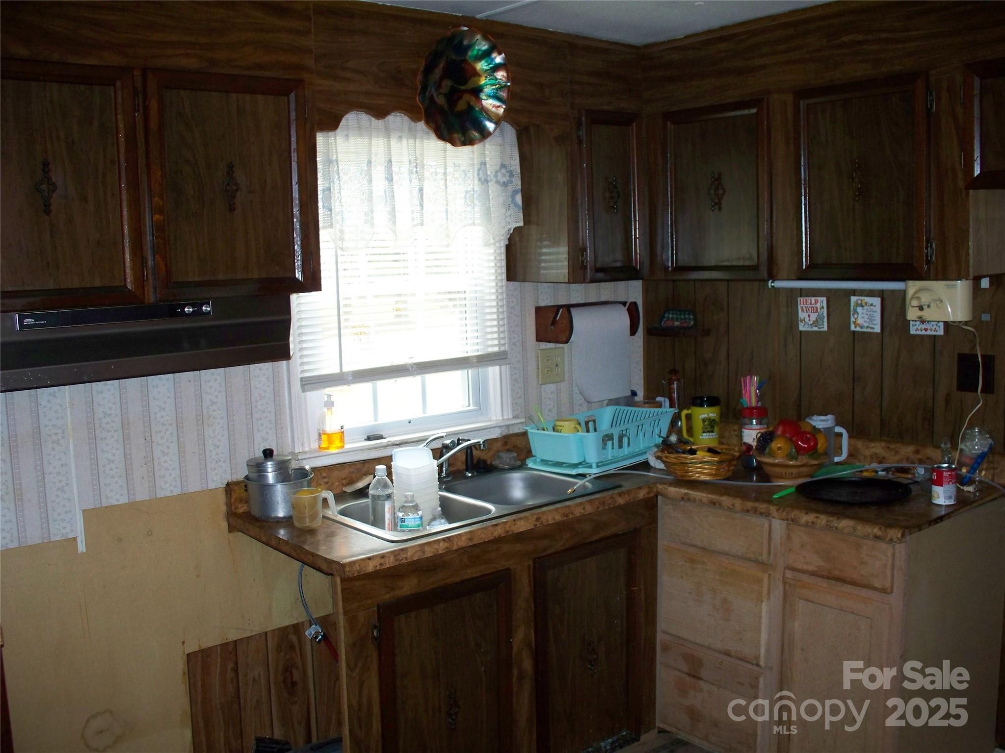 914 Salem Church Road Lincolnton, NC 28092 - Photo 12 of 22 a kitchen with sink cabinets and window