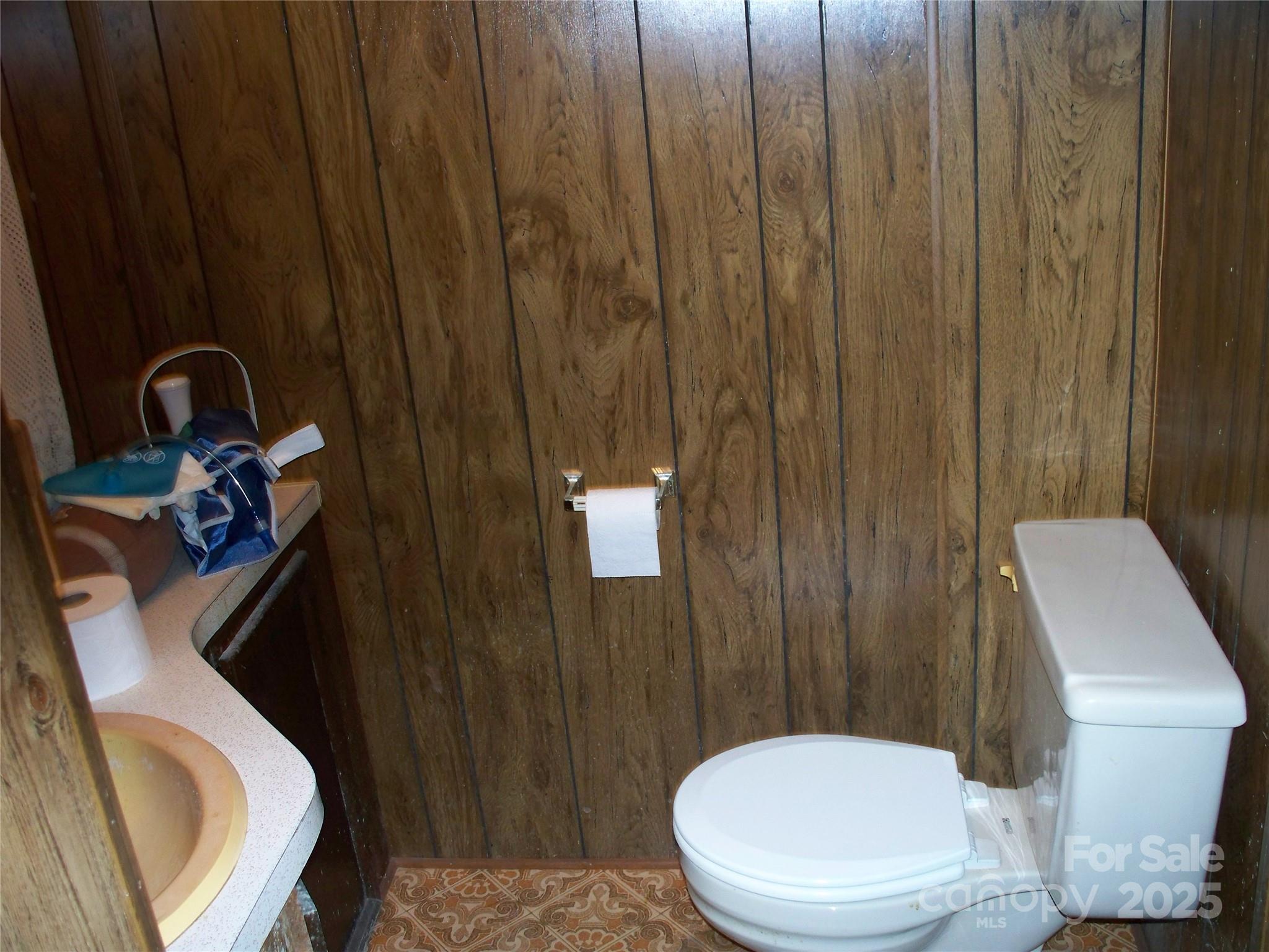 914 Salem Church Road Lincolnton, NC 28092 - Photo 19 of 22 a white toilet sitting next to a bathroom sink