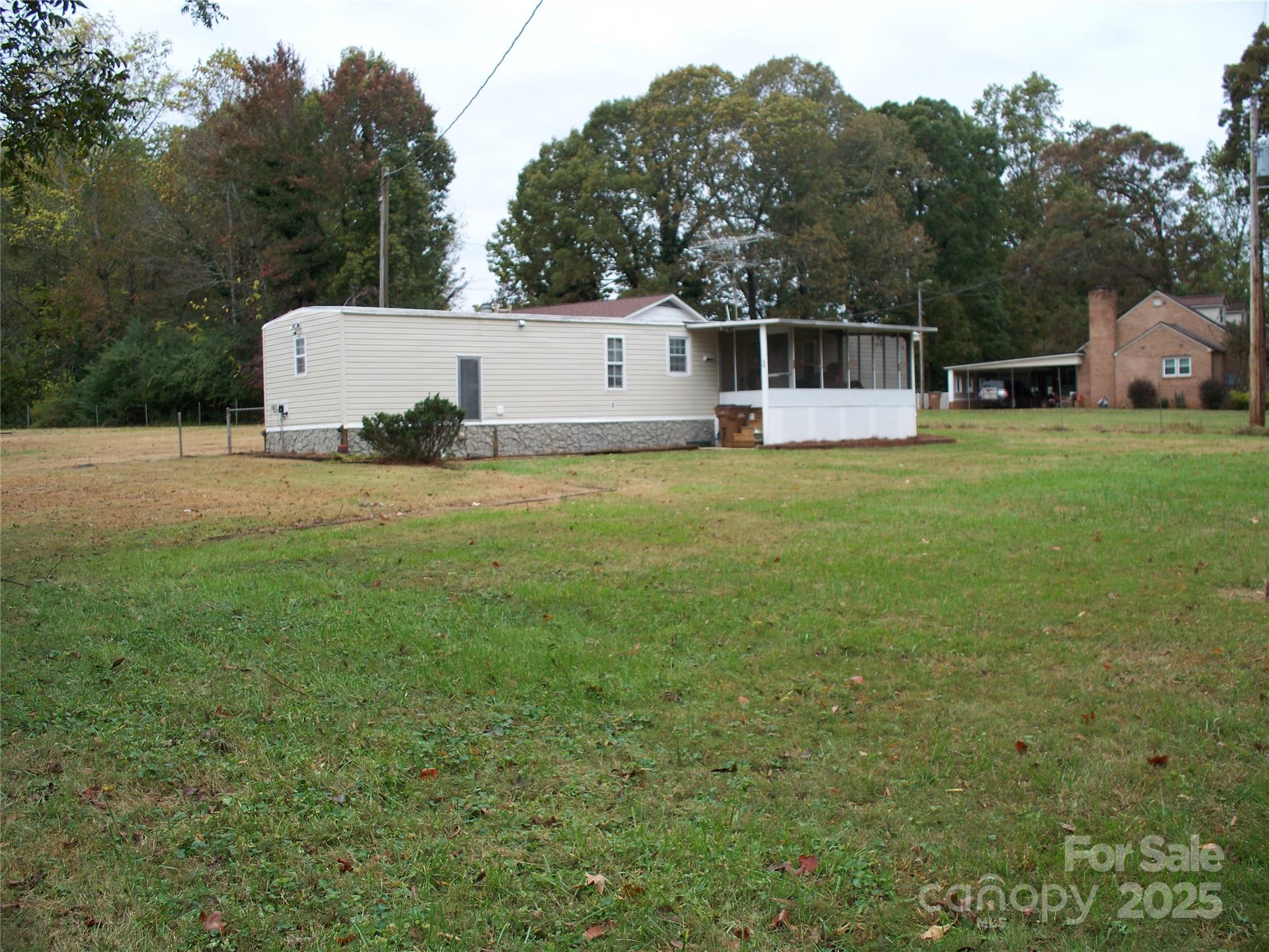 914 Salem Church Road Lincolnton, NC 28092 - Photo 3 of 22 a front view of house with yard and trees in the background