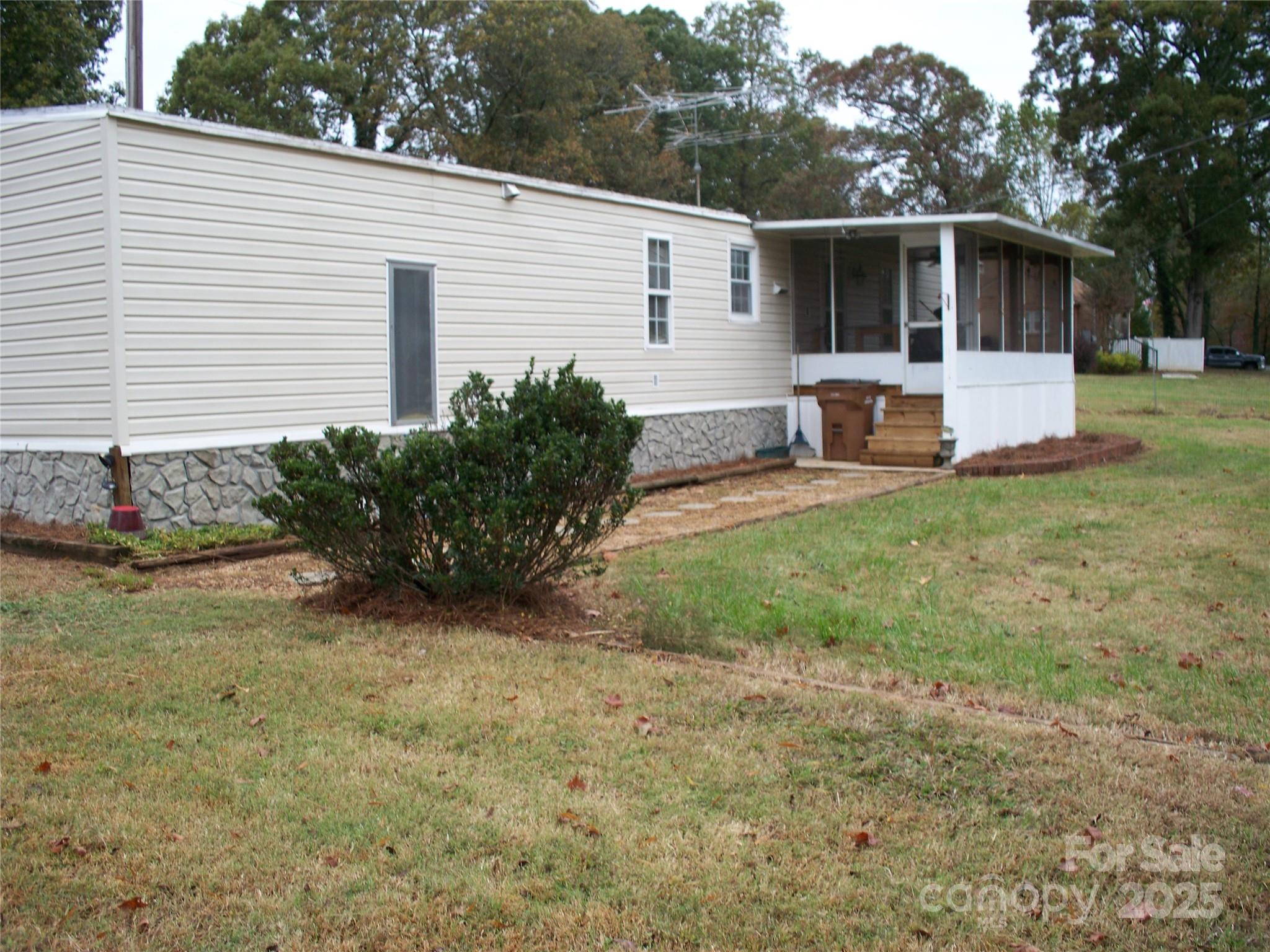 914 Salem Church Road Lincolnton, NC 28092 - Photo 7 of 22 a view of a house with backyard and a garden