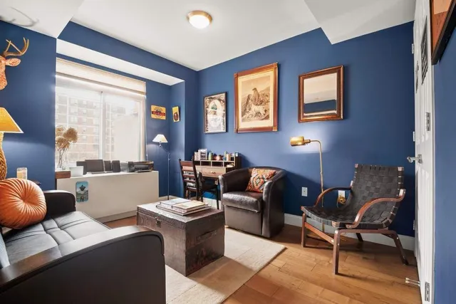 a spacious bedroom with a large bed and a large window