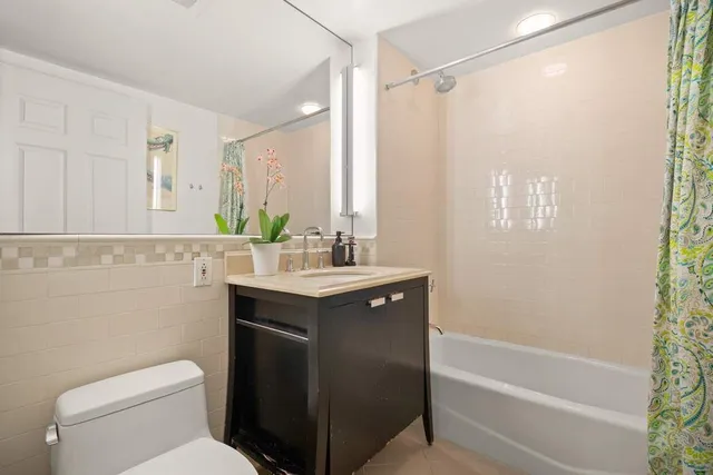 a view of a livingroom with furniture and staircase