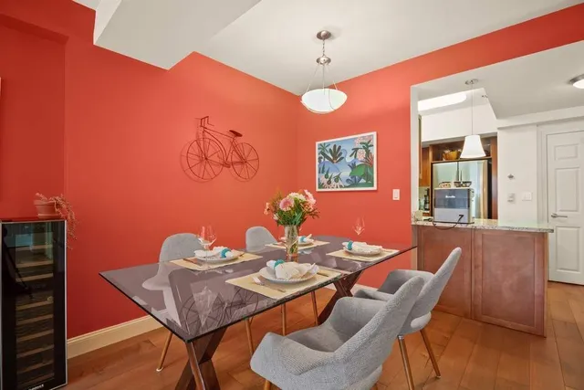 a dining room with furniture and wooden floor