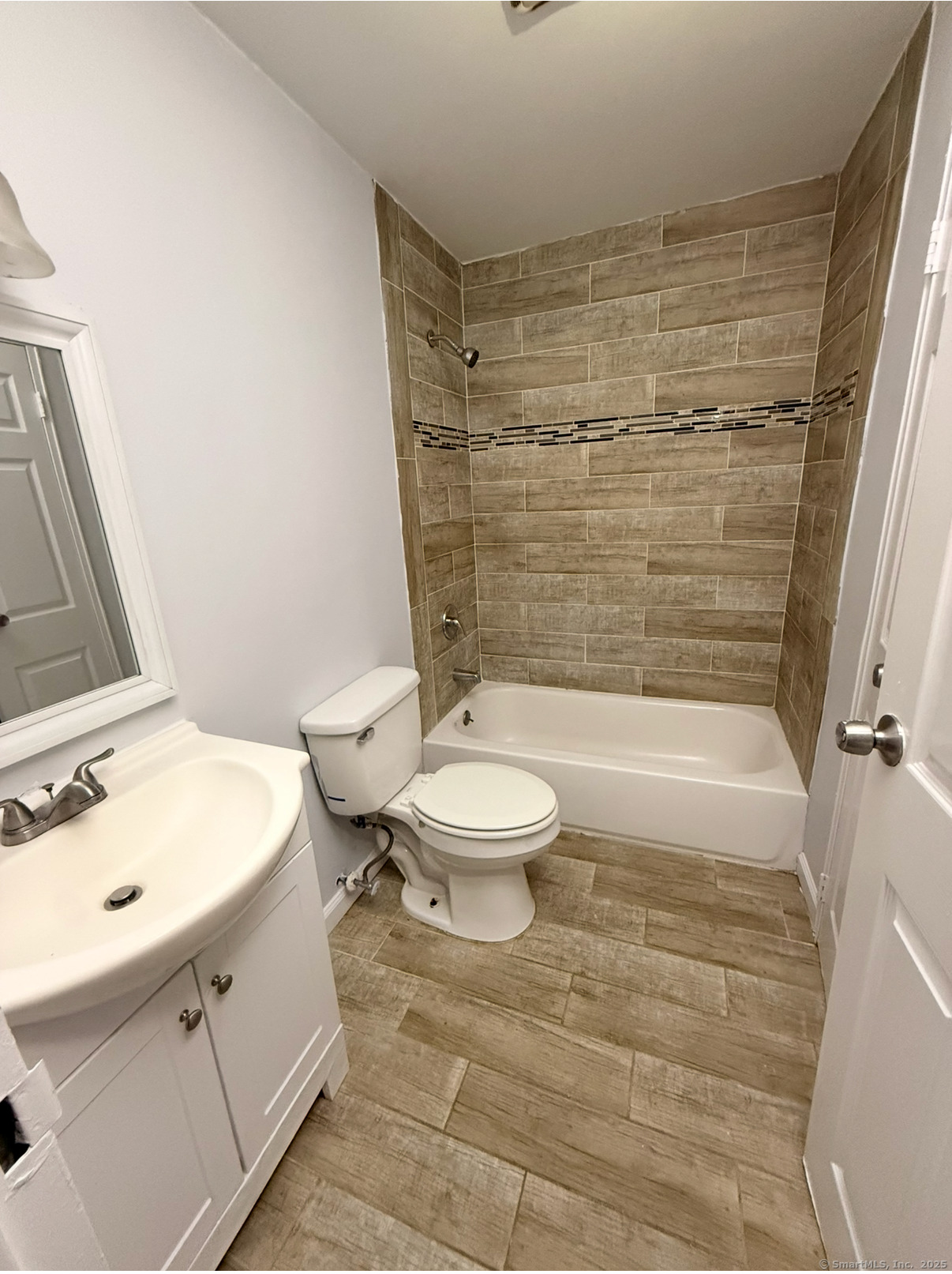 24 Coleman Street, Unit K West Haven, CT 06516 - Photo 6 of 6 a bathroom with a sink a toilet and shower