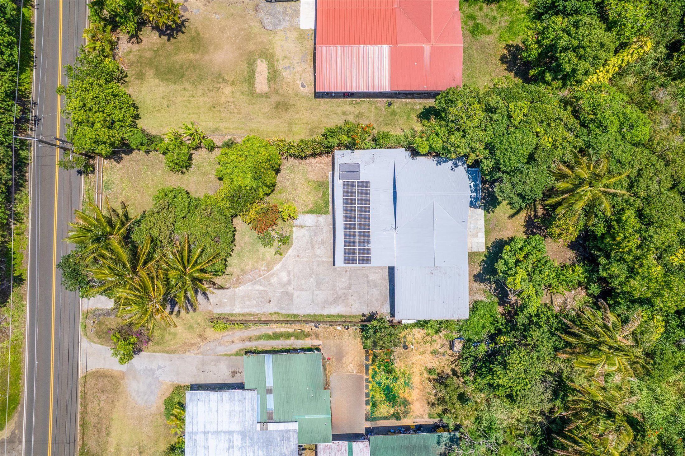 55-545 Hawi Road Hawi, HI 96719 - Photo 9 of 27 an aerial view of a house with a yard and garden
