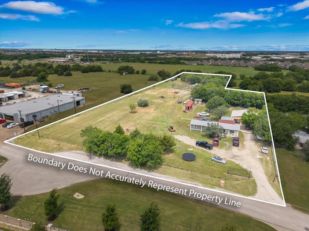 2511 Mathis Road Mansfield, TX 76063 - Photo 11 of 23 Expansive rural property featuring a main residence, multiple outbuildings, and mature trees