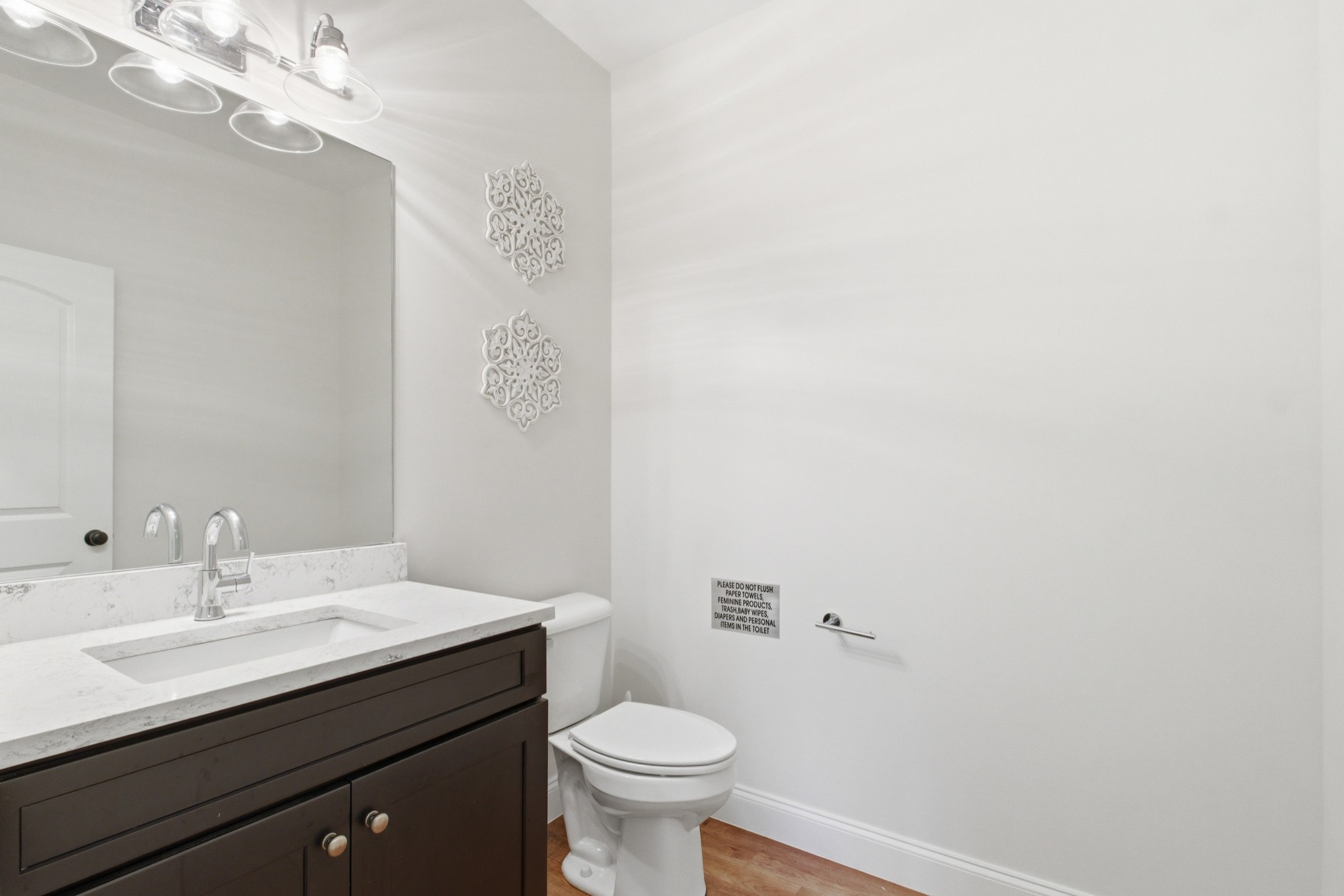 7075 Pinewood Road Nunnelly, TN 37137 - Photo 35 of 49 a bathroom with a sink a toilet and a mirror