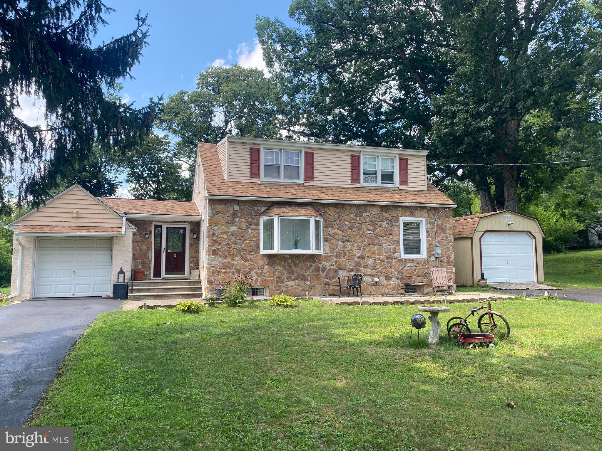 2181 Yerger Road Pottstown, PA 19464 - Photo 1 of 26 Charming stone home with lush greenery.
