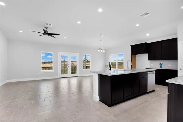 a view of kitchen with sink and microwave