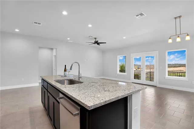 a kitchen with a sink and cabinets