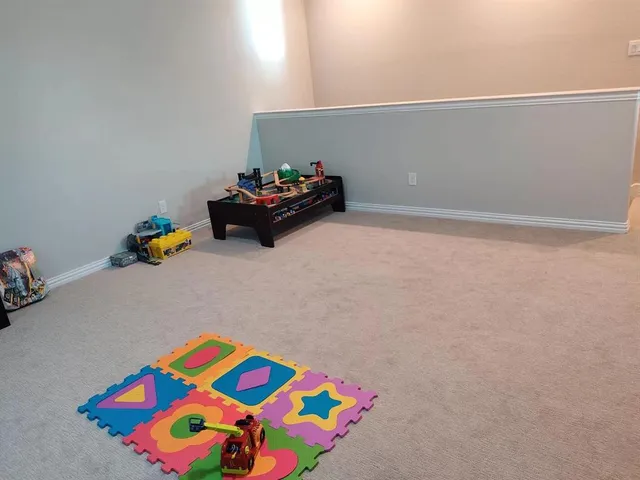 a bedroom with a bed and toys