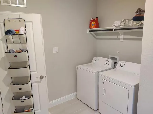 a utility room with dryer and washer