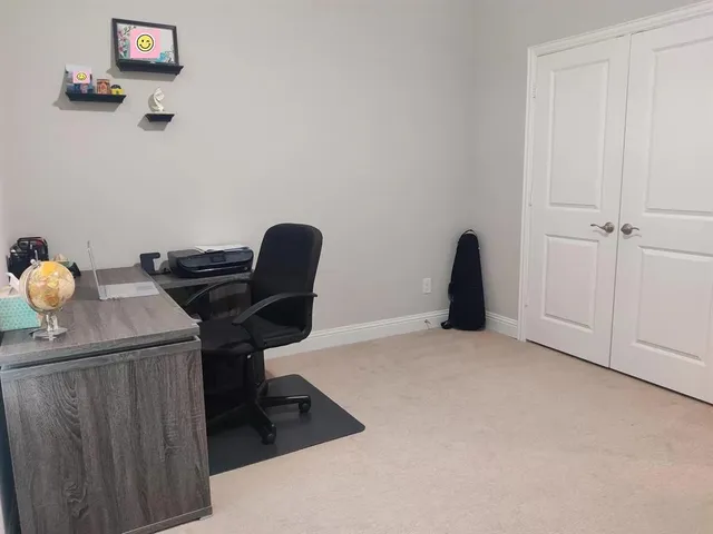 a room with hard wood floors and a window