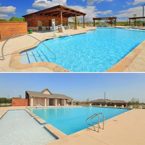 a view of a swimming pool with seating area