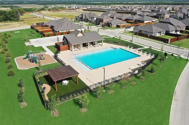 a view of a park with big trees