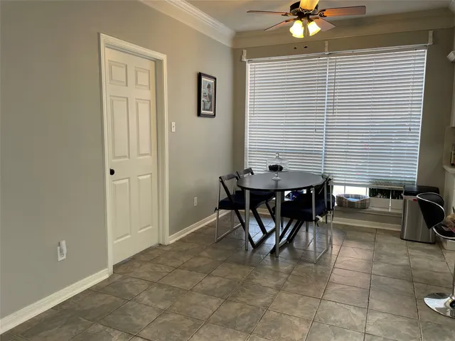 a dining room with furniture and chandelier