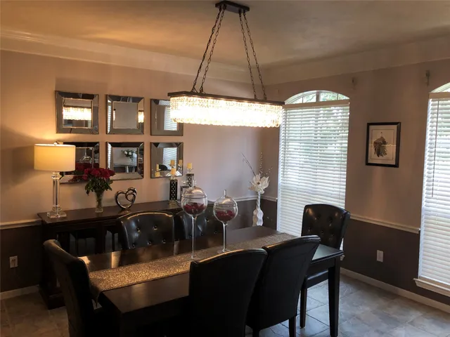 a view of a dining room with furniture and window