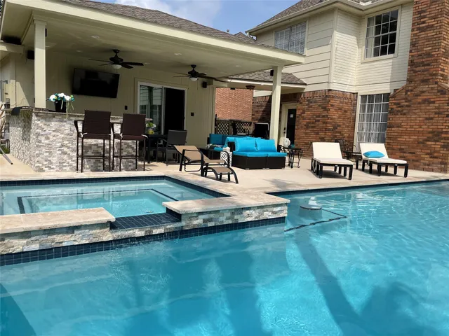a view of a house with backyard porch and patio