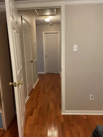 a view of a livingroom with wooden floor