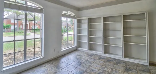 a view of an empty room with a window