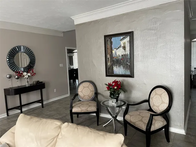 a living room with furniture and a mirror