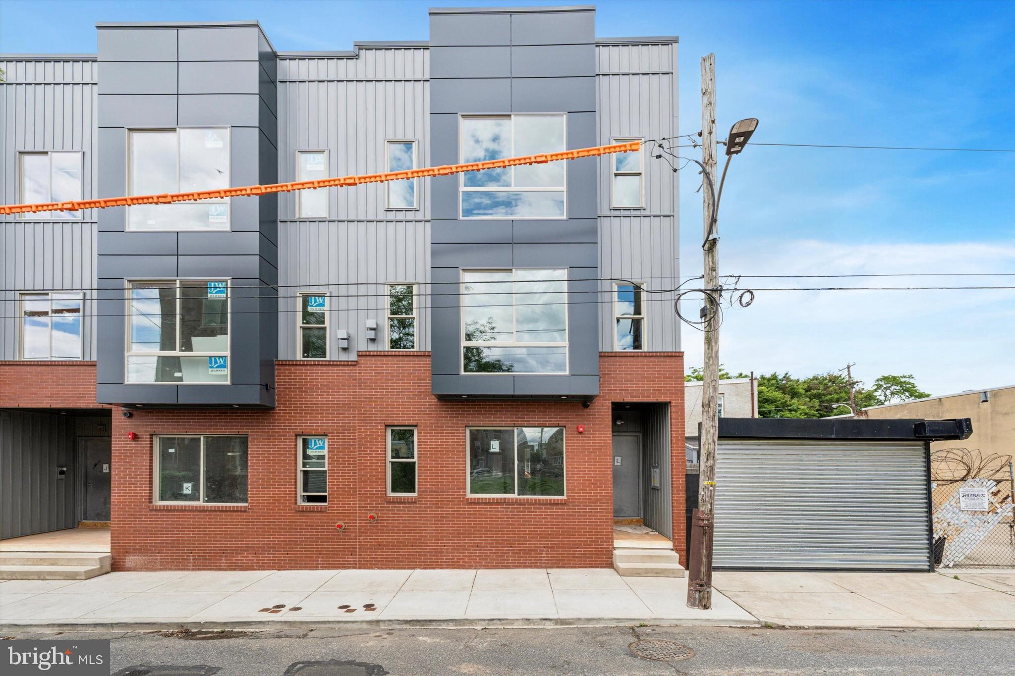 2401 North 2nd Street, Unit F3 Philadelphia, PA 19133 - Photo 20 of 26 a front view of a building with many windows