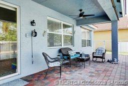 2120 Northwest Marsh Rabbit Lane Jensen Beach, FL 34957 - Photo 22 of 34 a dining room with furniture window and wooden floor