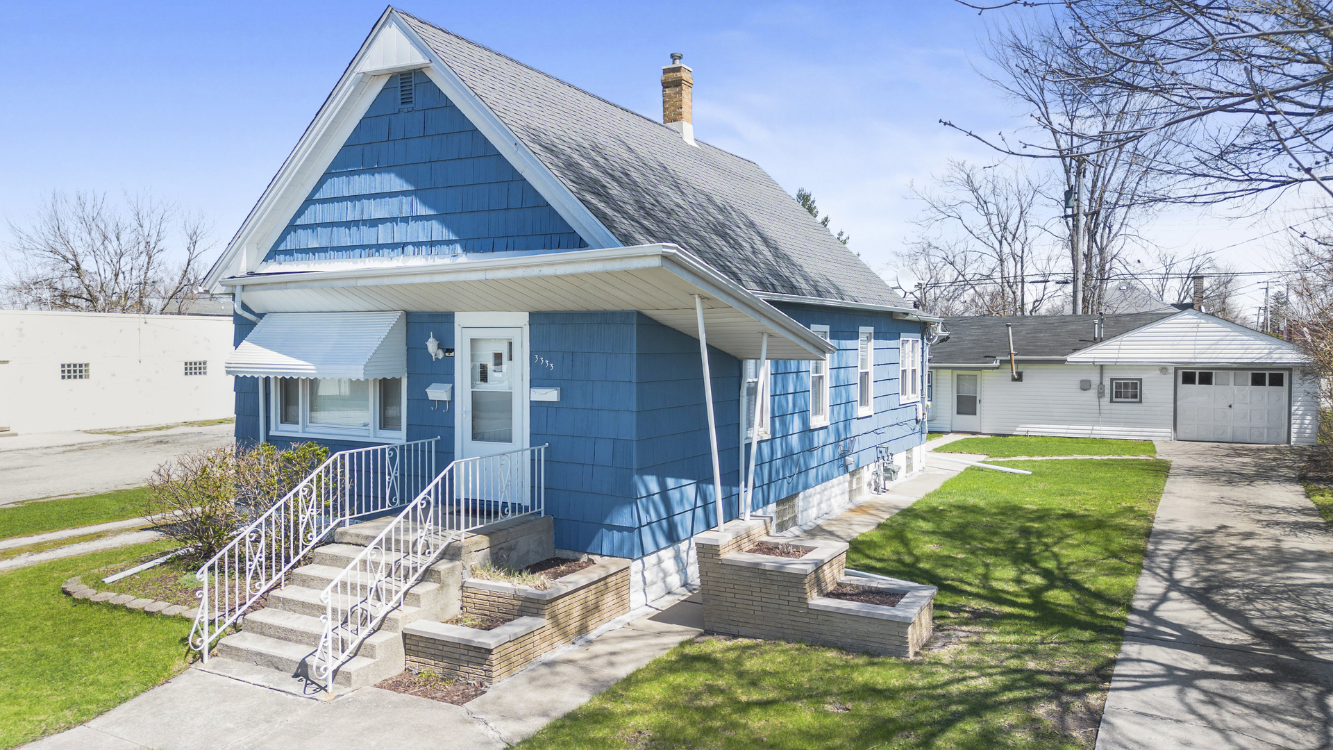 a view of an house with backyard porch and sitting area