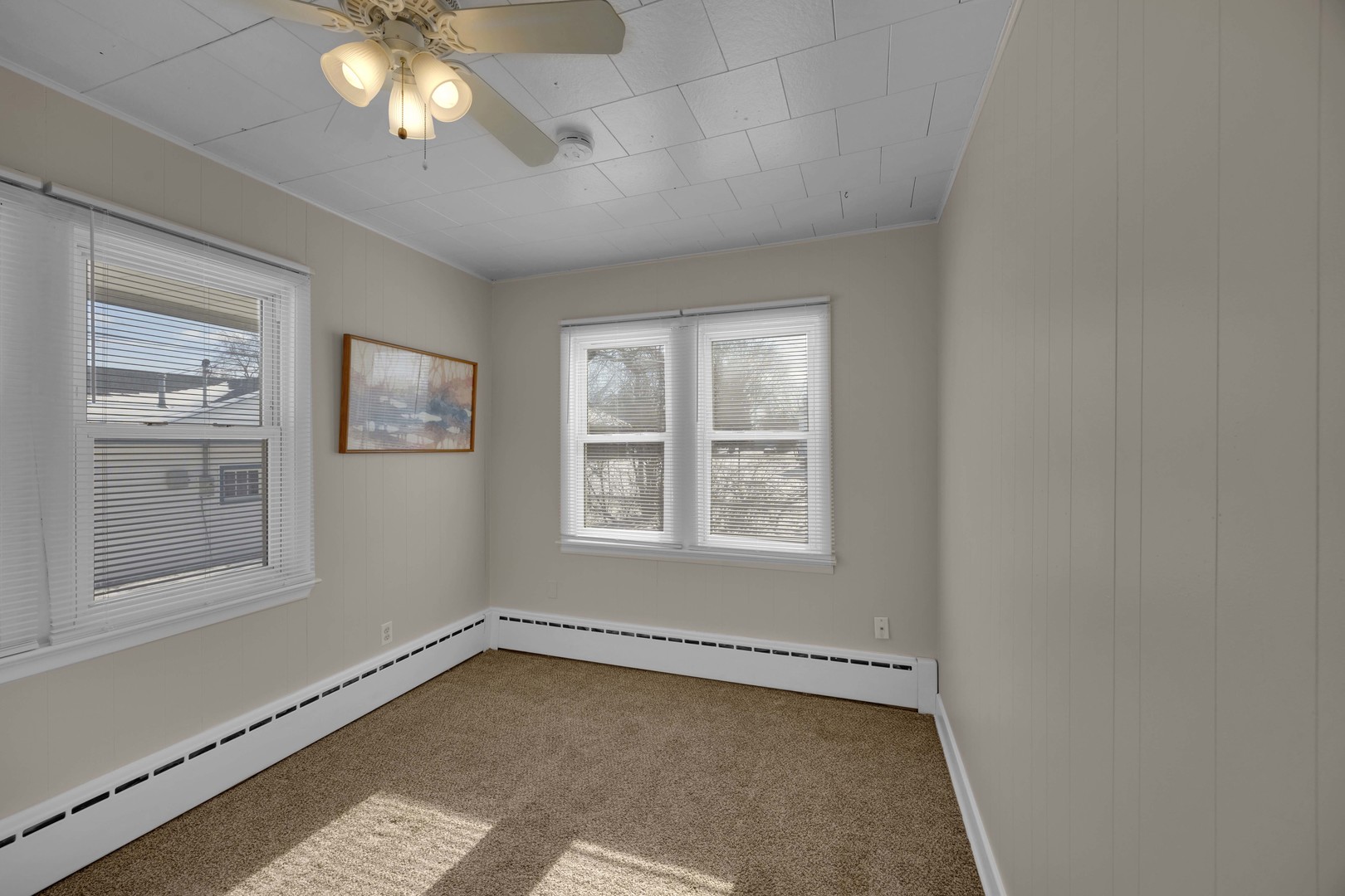 3333 Union Avenue Steger, IL 60475 - Photo 13 of 31 a view of an empty room with a window and wooden floor