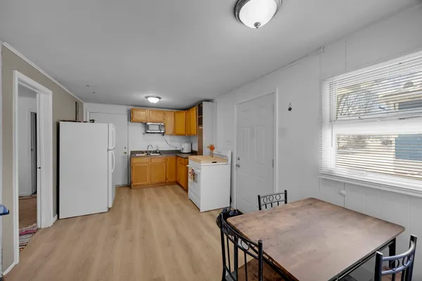 a kitchen with refrigerator and windows