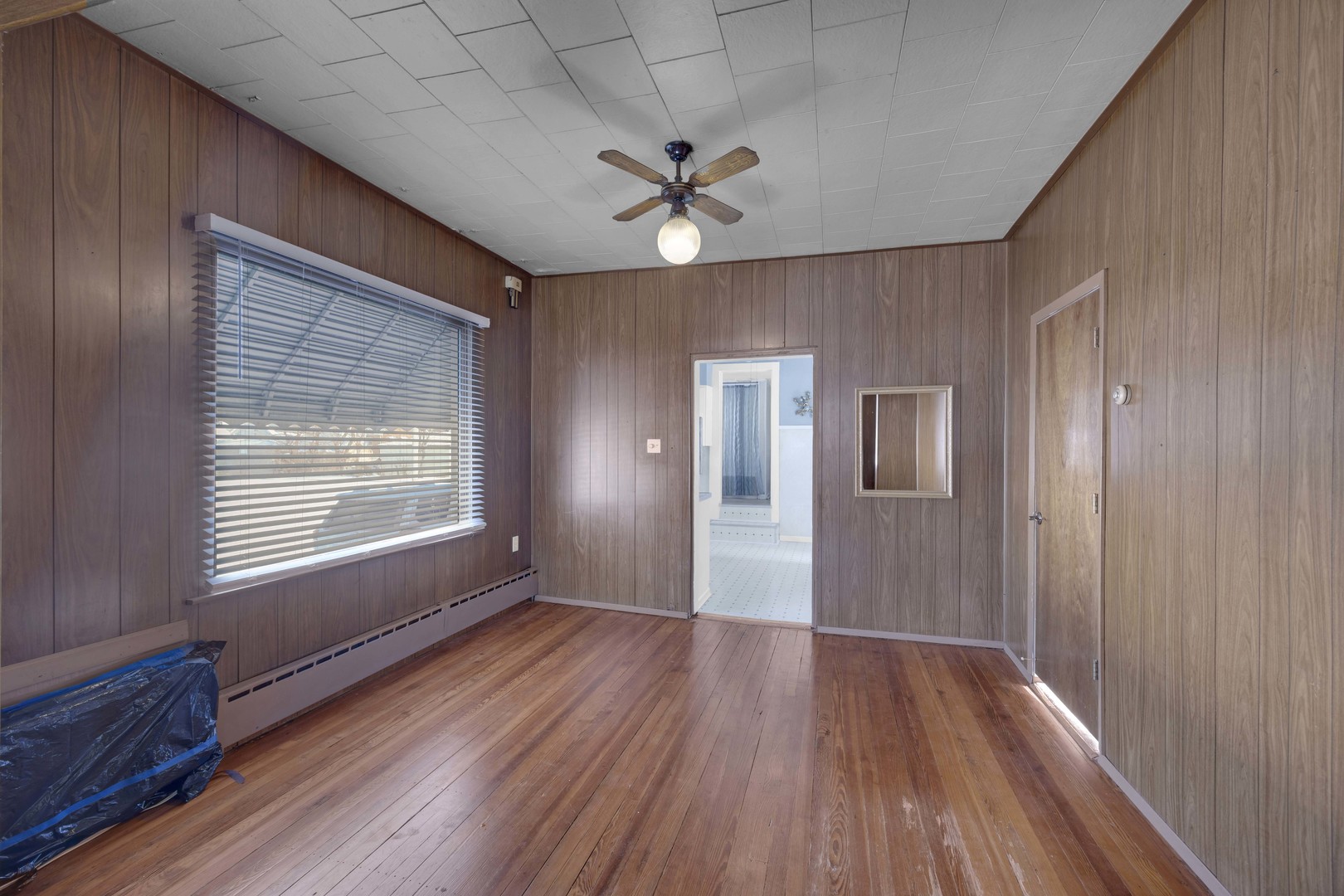 3333 Union Avenue Steger, IL 60475 - Photo 16 of 31 a view of an empty room with wooden floor and a window