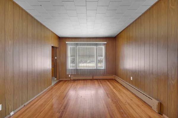 a view of wooden floor and staircase in a room