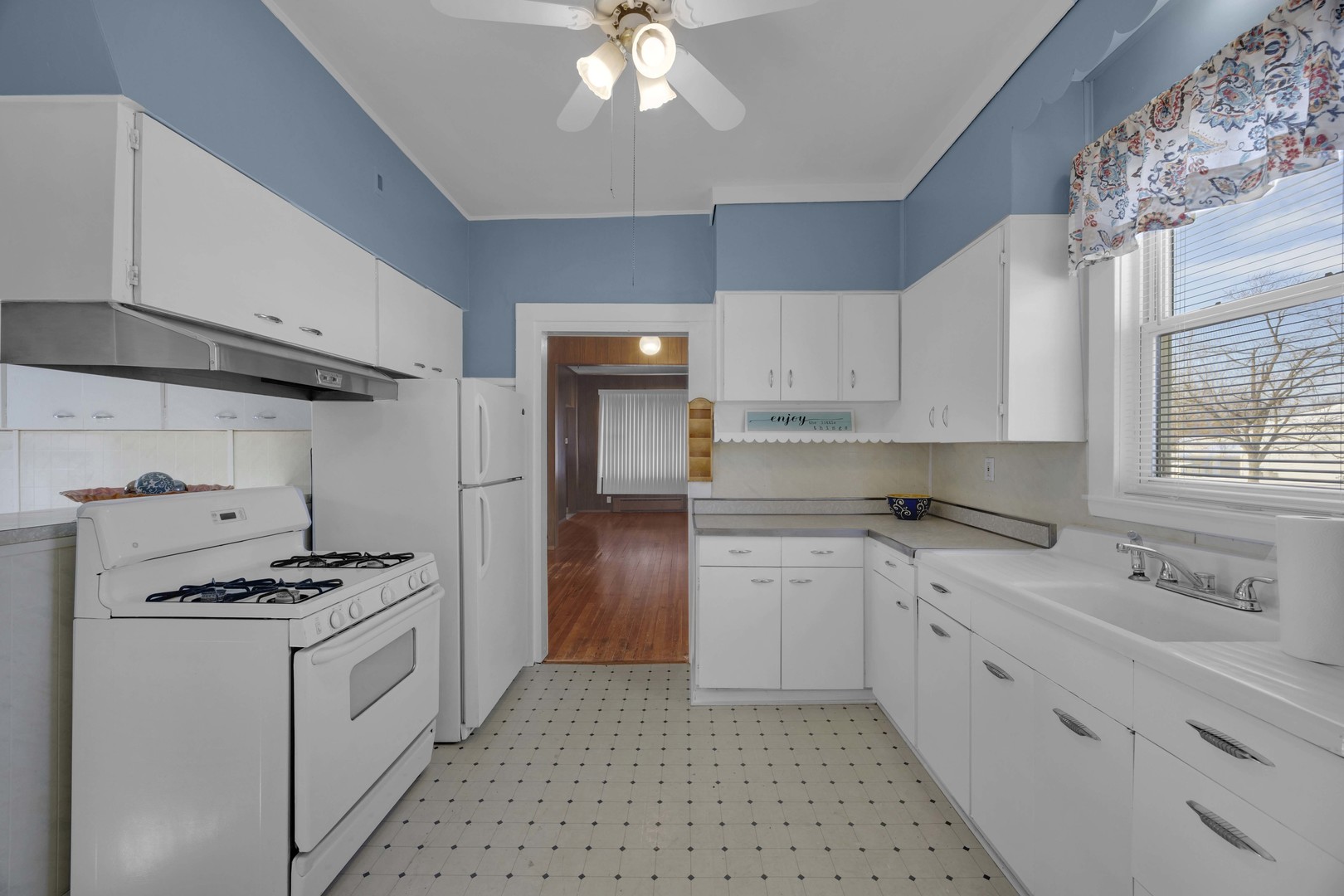 3333 Union Avenue Steger, IL 60475 - Photo 21 of 31 a kitchen with granite countertop a sink cabinets stainless steel appliances and a window