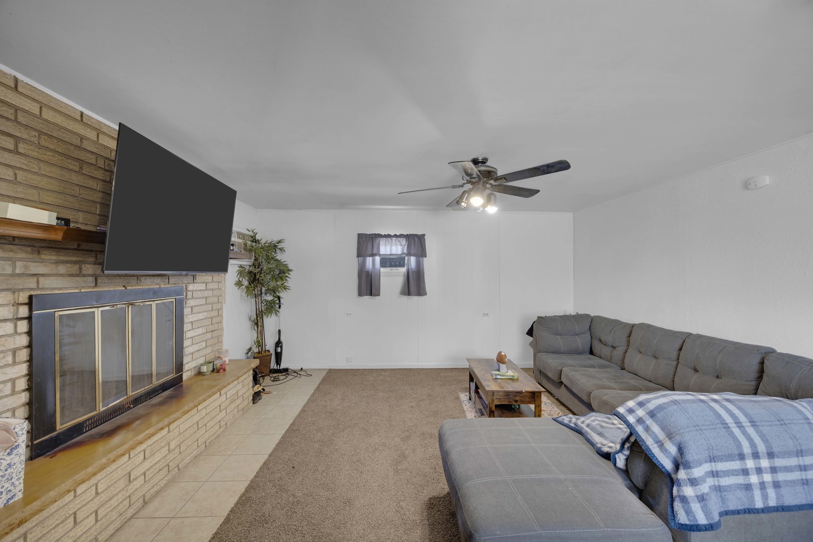 3333 Union Avenue Steger, IL 60475 - Photo 6 of 31 a living room with furniture and a flat screen tv