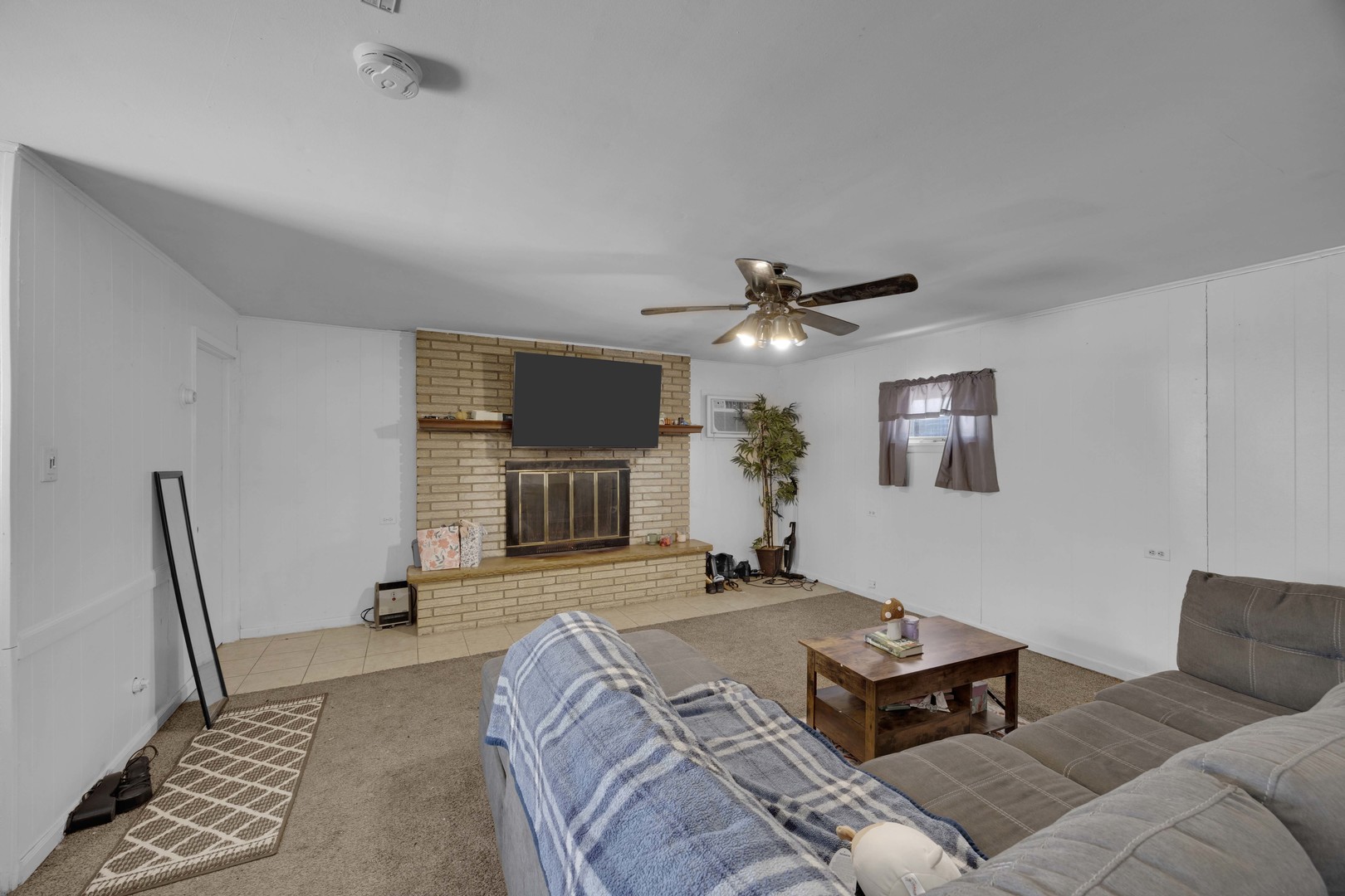 3333 Union Avenue Steger, IL 60475 - Photo 8 of 31 a bedroom with a bed couch and a fireplace