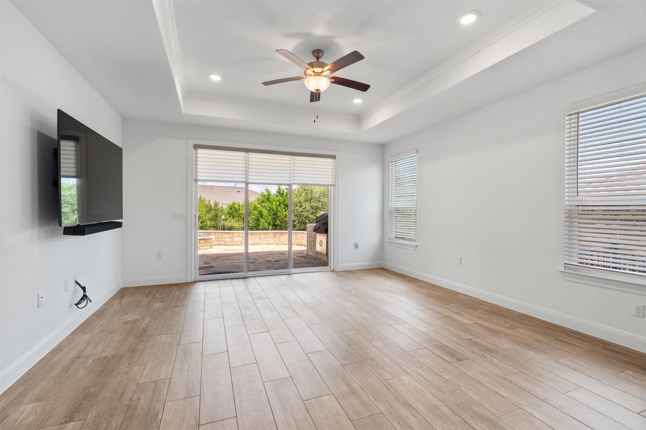 202 Spanish Star Street Georgetown, TX 78633 - Photo 15 of 32 a view of an empty room with wooden floor and a window