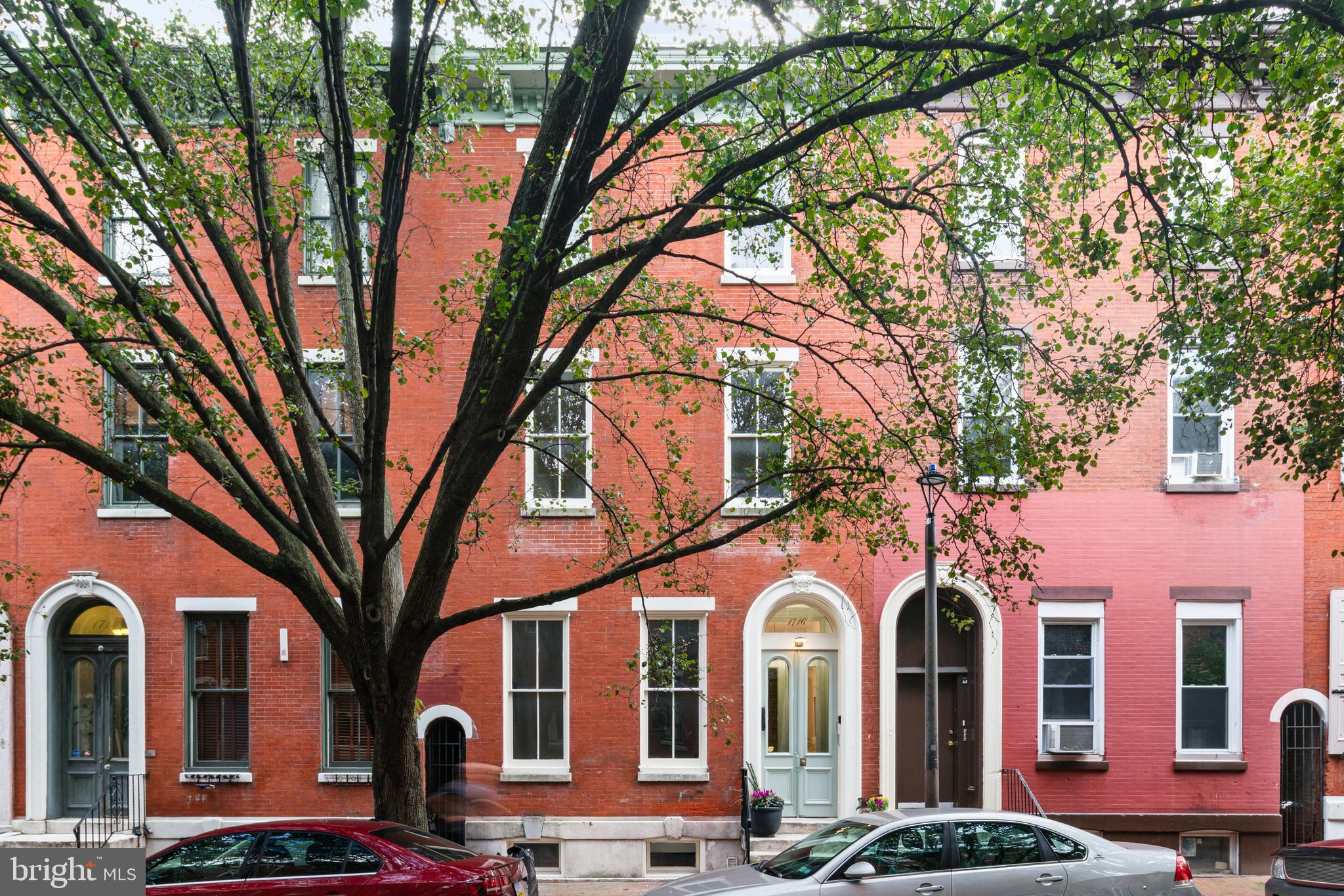 1716 Wallace Street, Unit 202 Philadelphia, PA 19130 - Photo 12 of 12 a front view of a building with large trees
