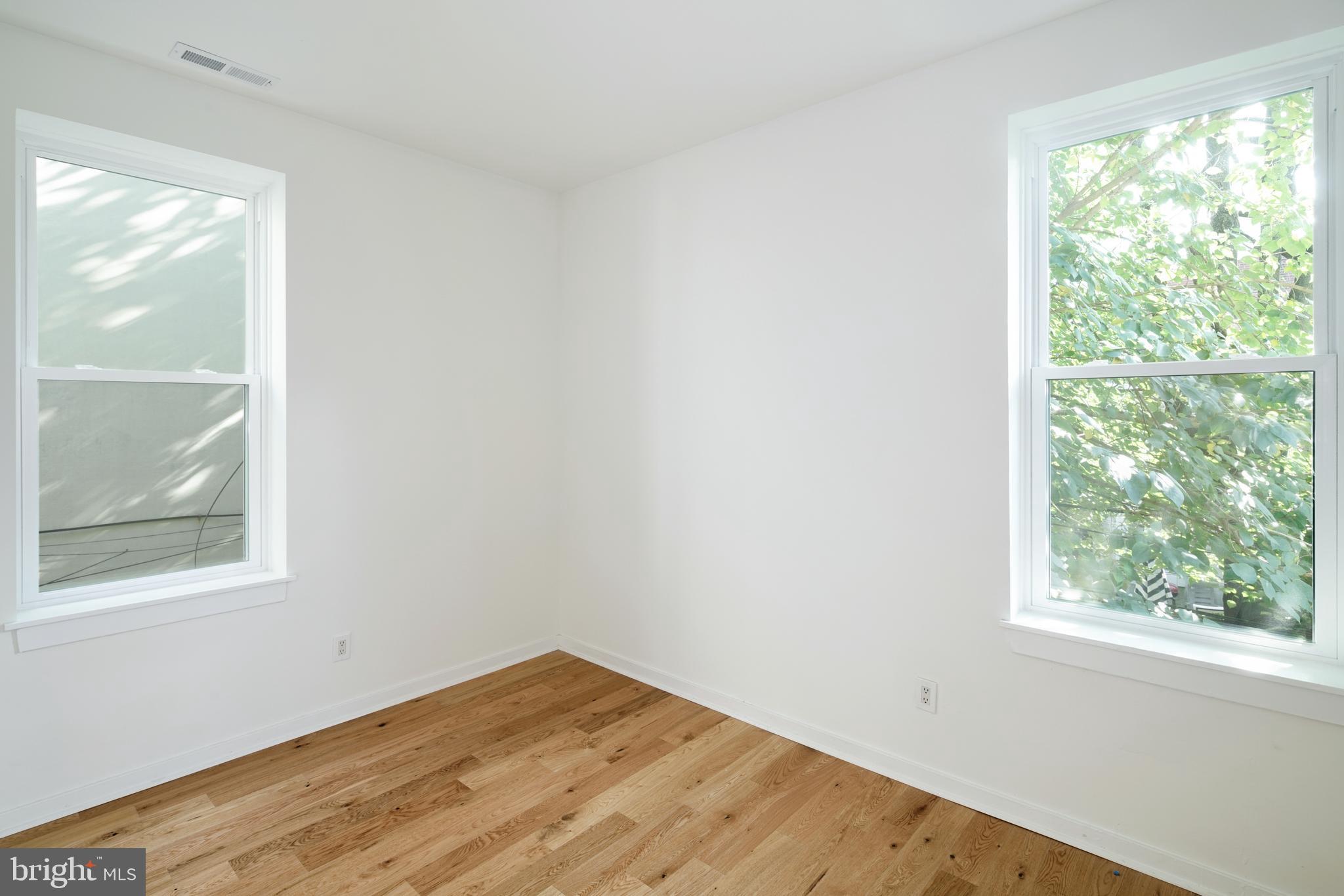 1716 Wallace Street, Unit 202 Philadelphia, PA 19130 - Photo 6 of 12 an empty room with a window
