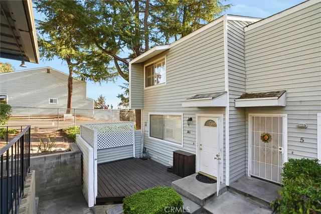 a view of a white house with many windows