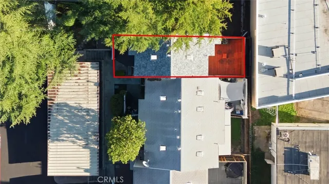 an aerial view of a house with a garden