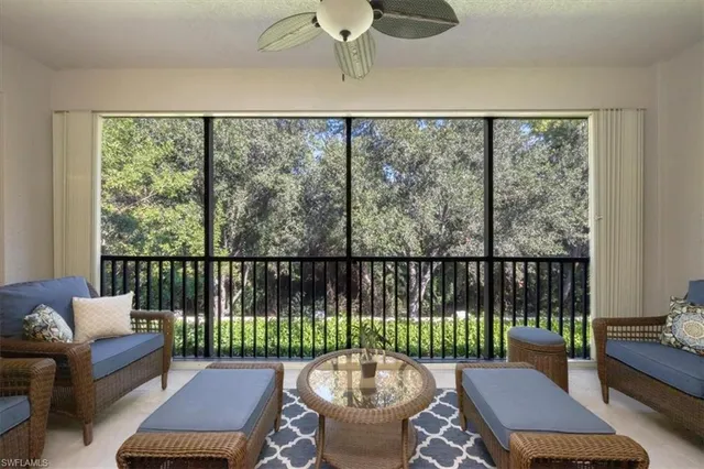 a balcony with furniture and wooden floor