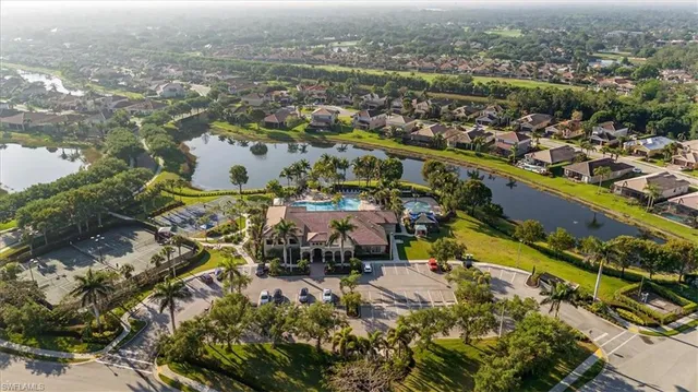 an aerial view of residential building and lake