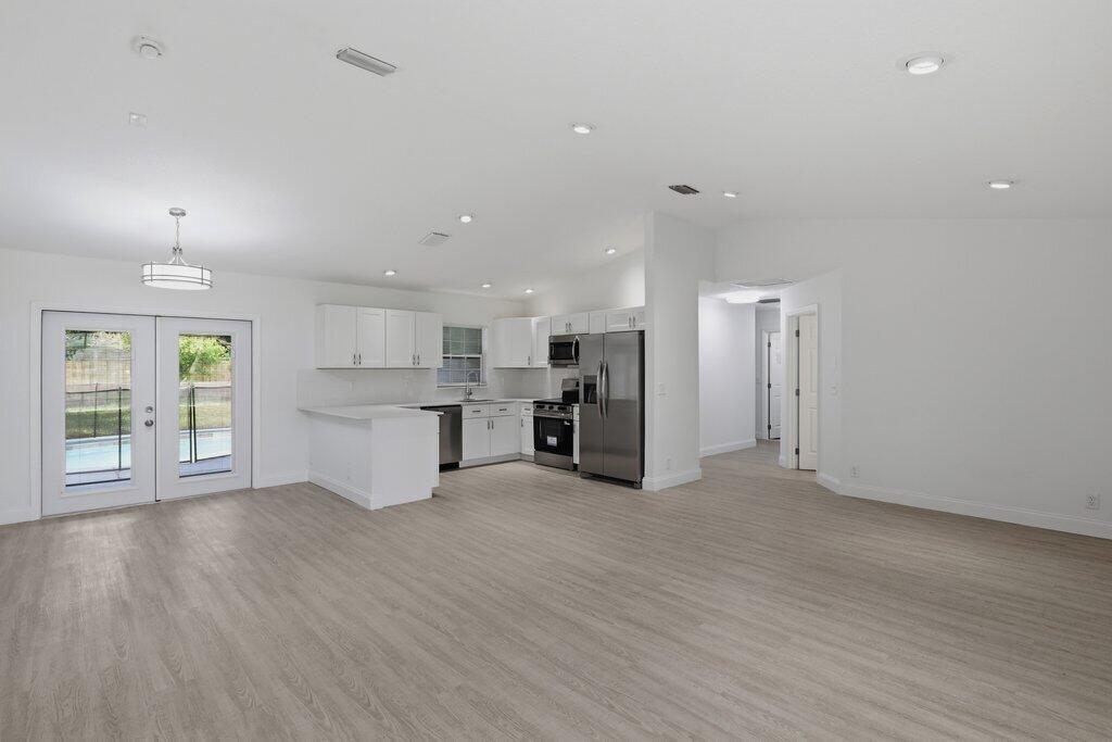 6900 2nd Street Jupiter, FL 33458 - Photo 16 of 24 Living to Kitchen.jpeg-SMALL