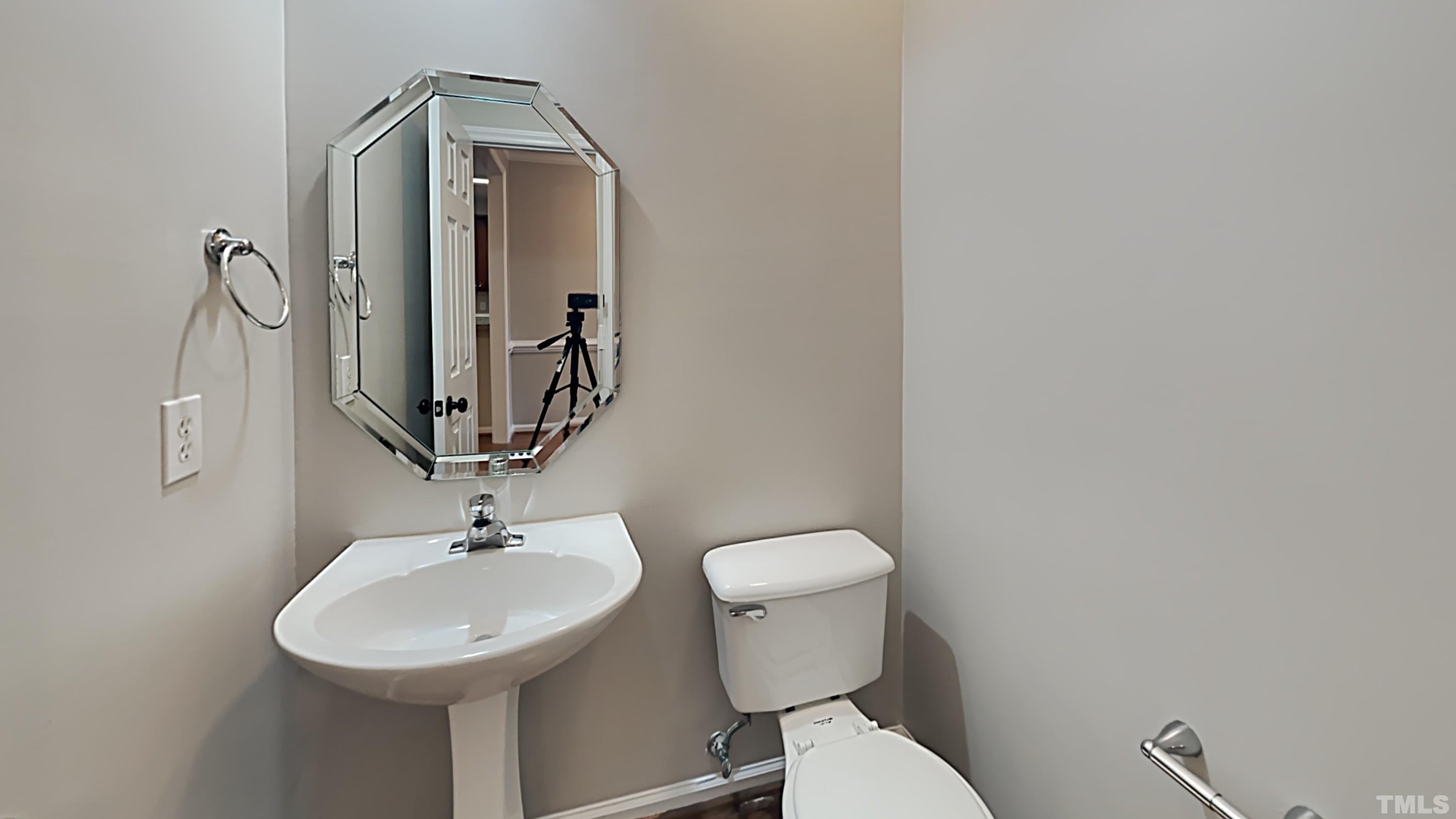 5020 Amberfield Way Raleigh, NC 27604 - Photo 11 of 24 a bathroom with a toilet sink and mirror