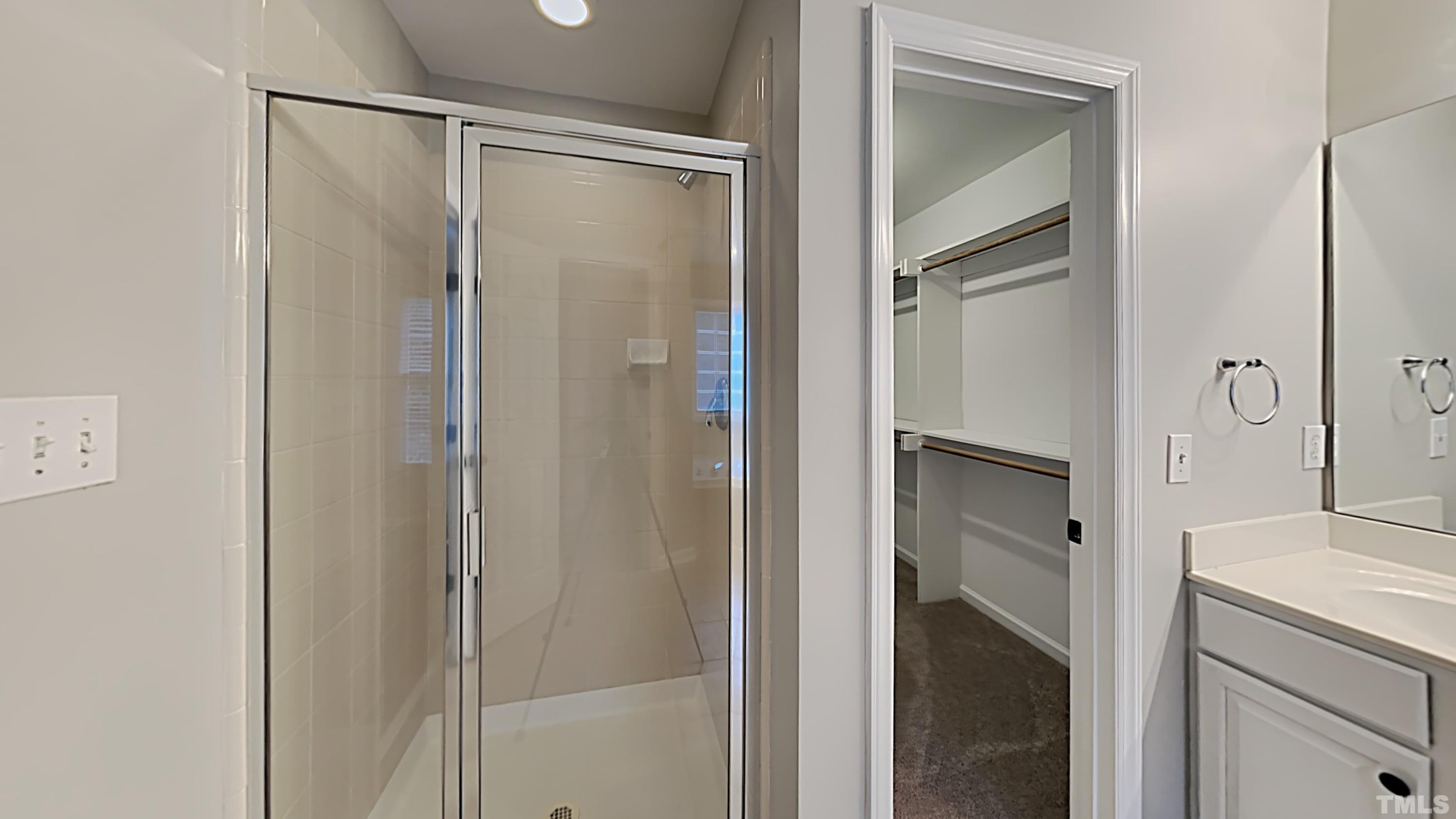 5020 Amberfield Way Raleigh, NC 27604 - Photo 15 of 24 a bathroom with a shower and a mirror