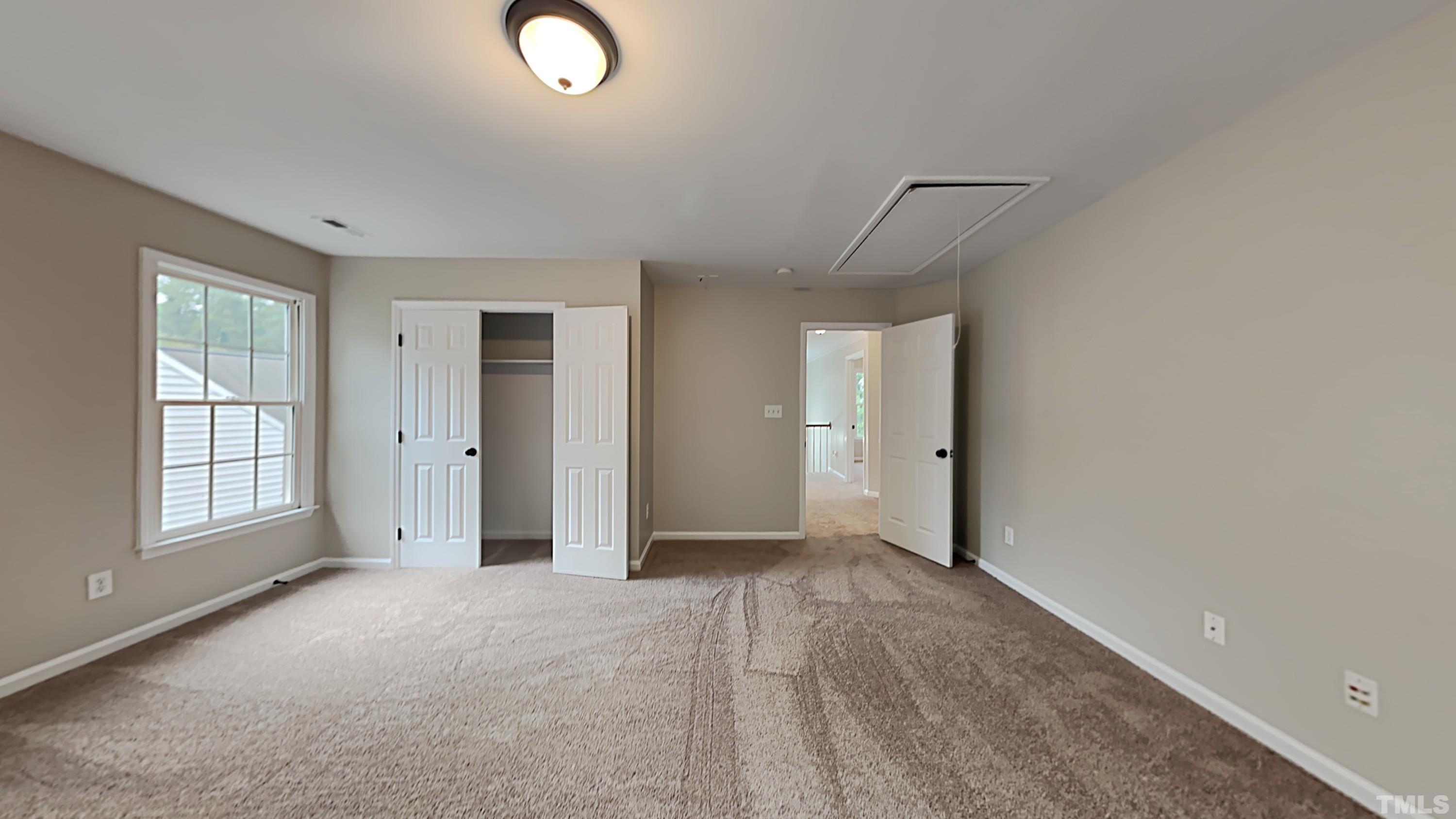 5020 Amberfield Way Raleigh, NC 27604 - Photo 18 of 24 an empty room with windows and closet