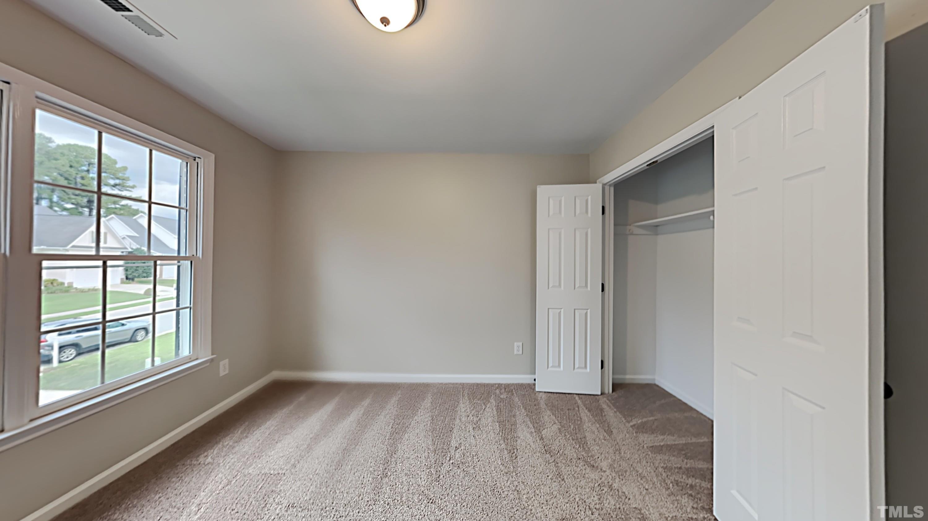 5020 Amberfield Way Raleigh, NC 27604 - Photo 20 of 24 a view of an empty room with a window